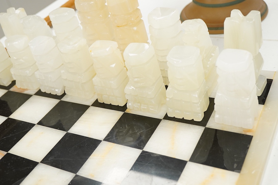 A black and white onyx chess set and board, largest piece, 14cm high